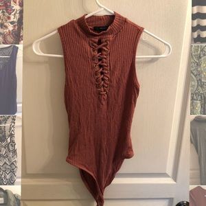 Raspberry colored bodysuit with lace up front